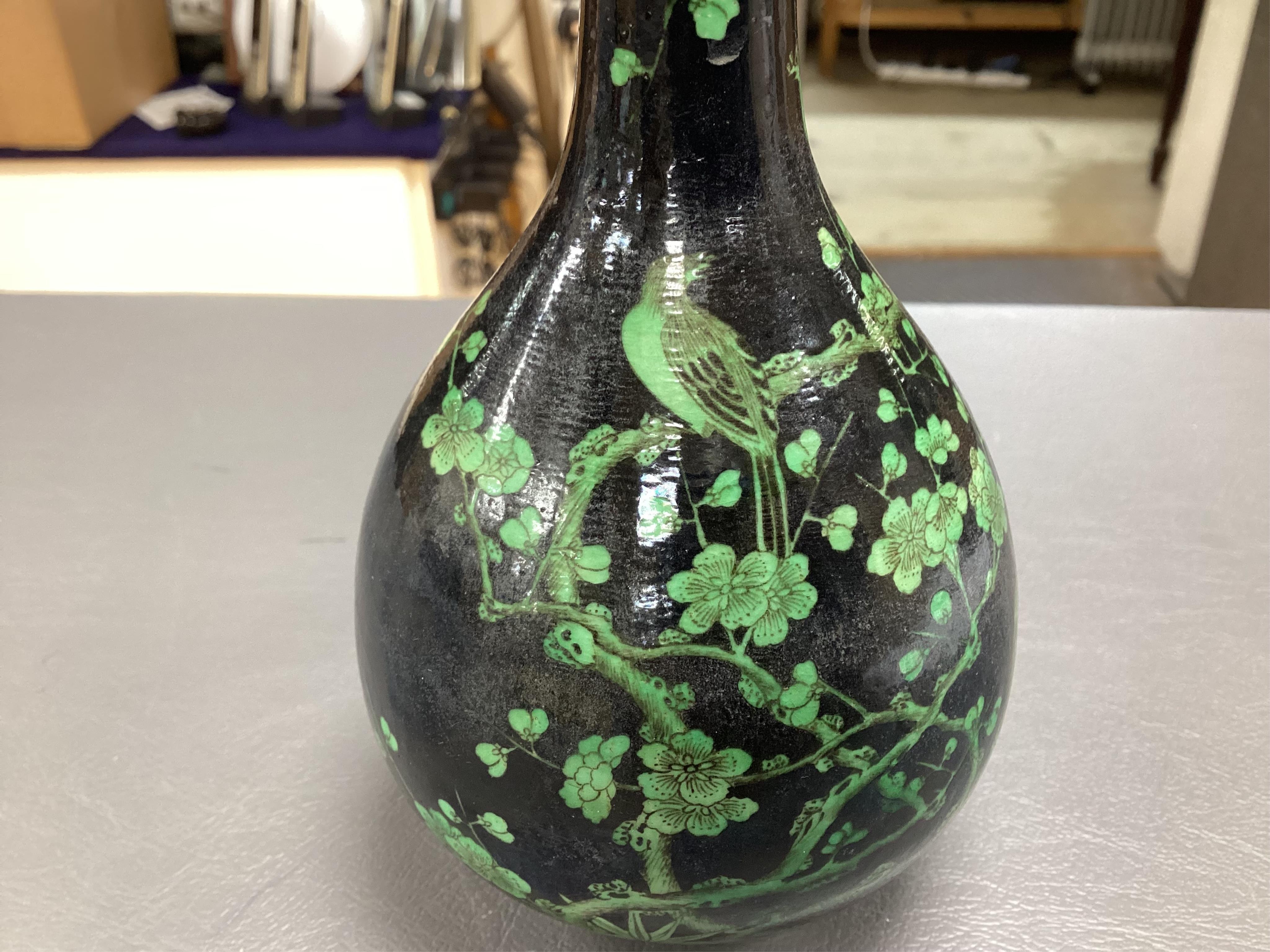 A Chinese famille noire bottle vase, 17cm high